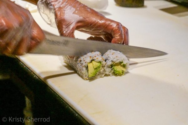 Cutting sushi rolls – Asia Garden